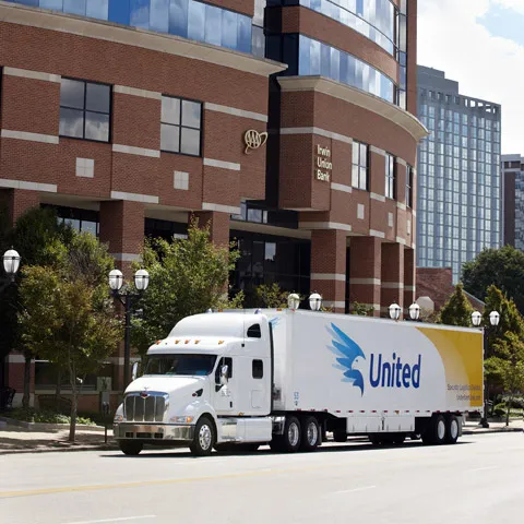 A United Van Lines truck on a city street